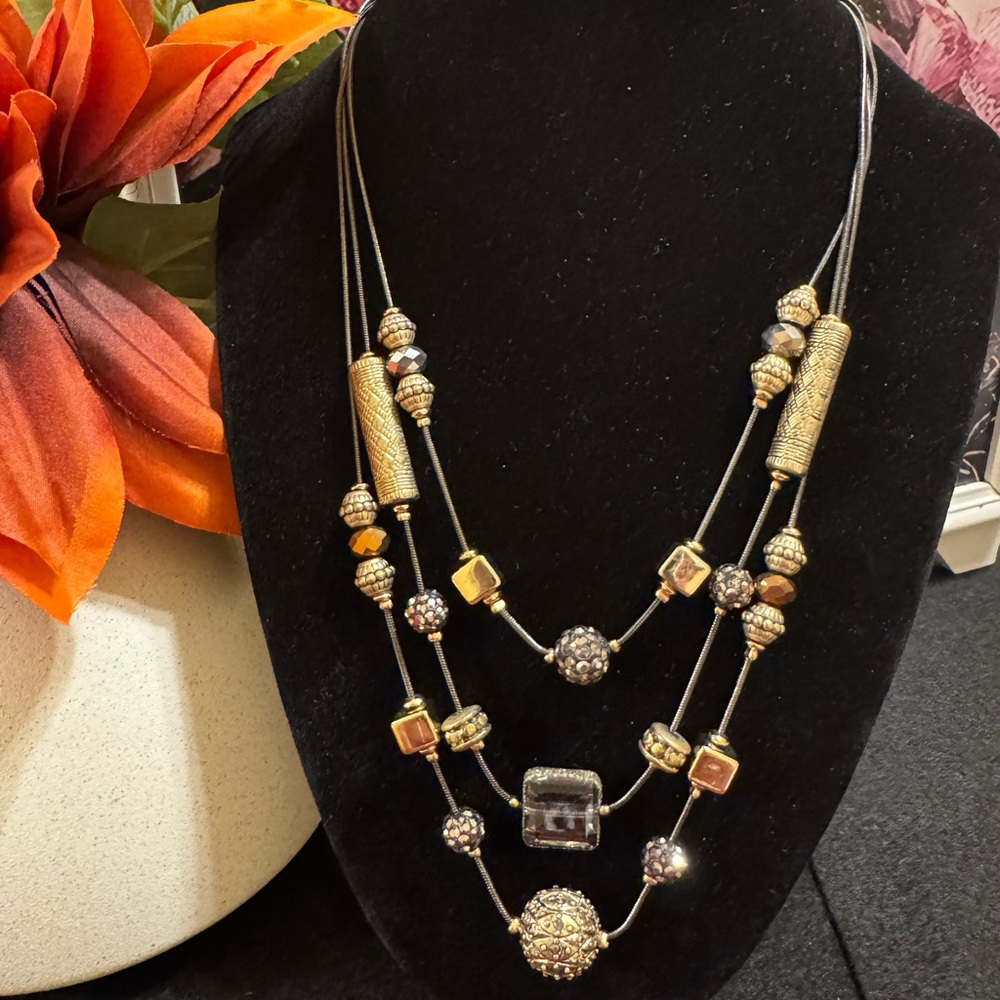 Chicos gunmetal 3 strand necklace with gold and silver tone accents and beading